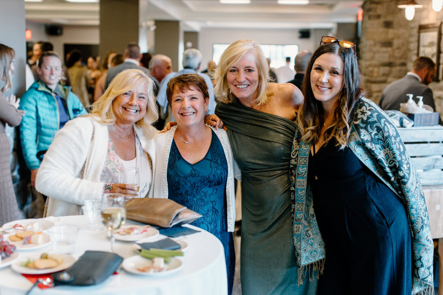 Guests posing for the camera in the Lake View Room
