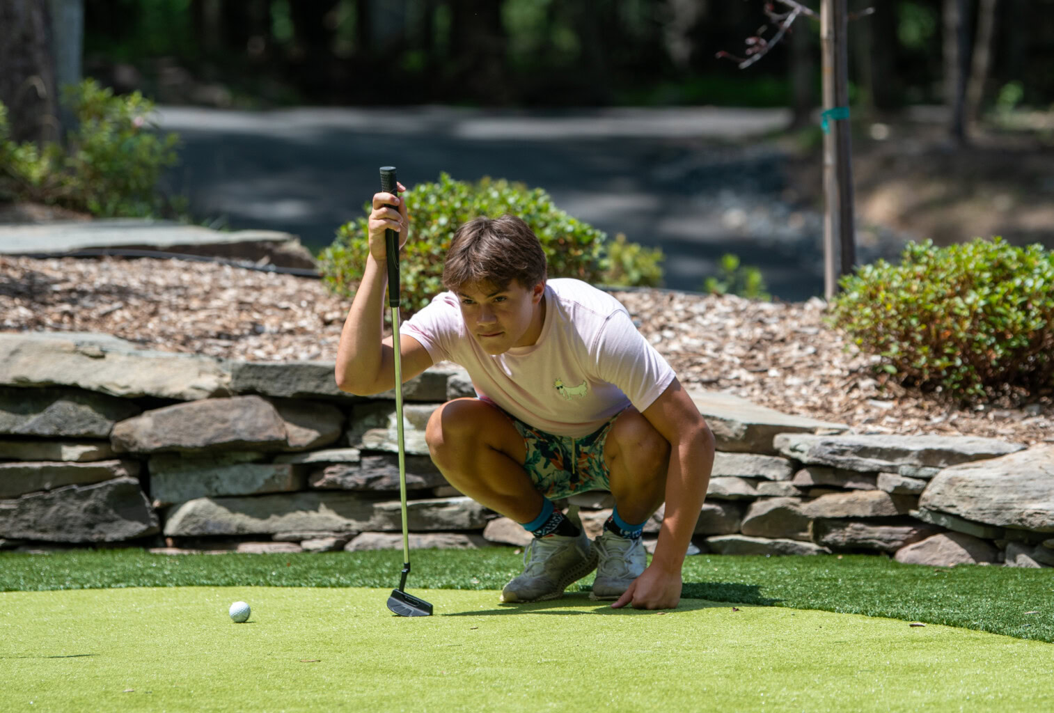 Lining up a shot on the putting green