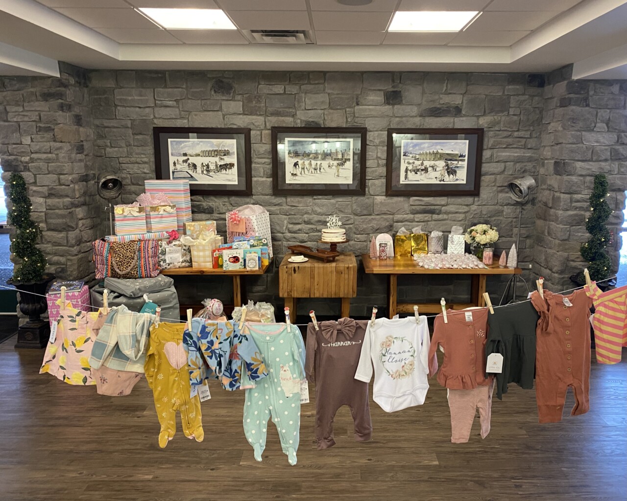 Baby shower clothes hanging on the line.