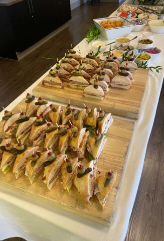 sandwiches on a buffet table.