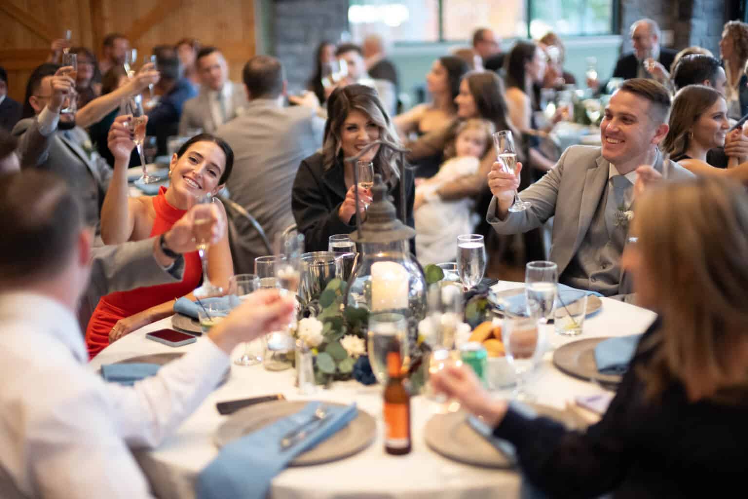 toast being made at a wedding dinner.