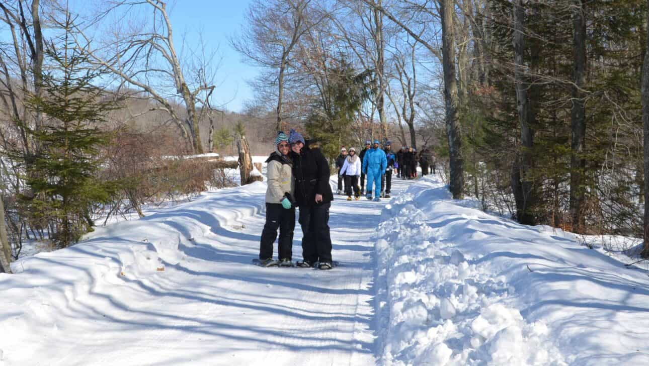 group on snowy walking path.