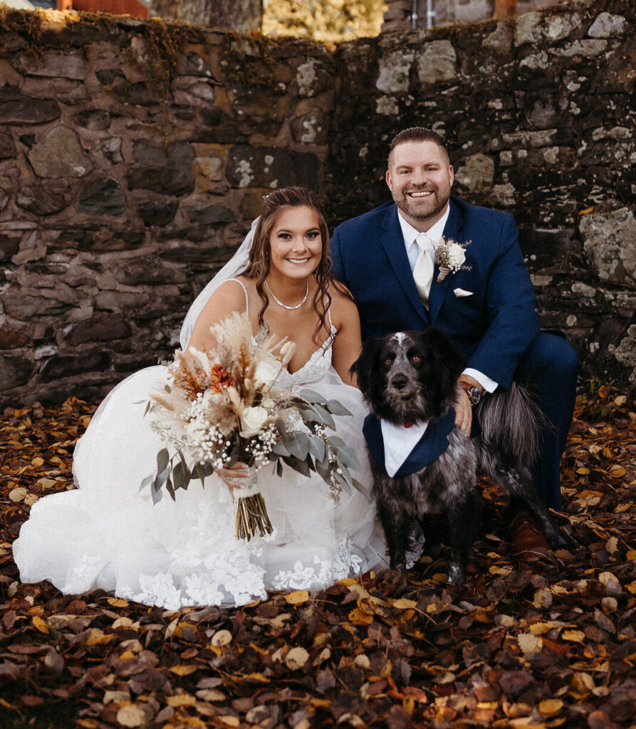 wedding couple with their dog.