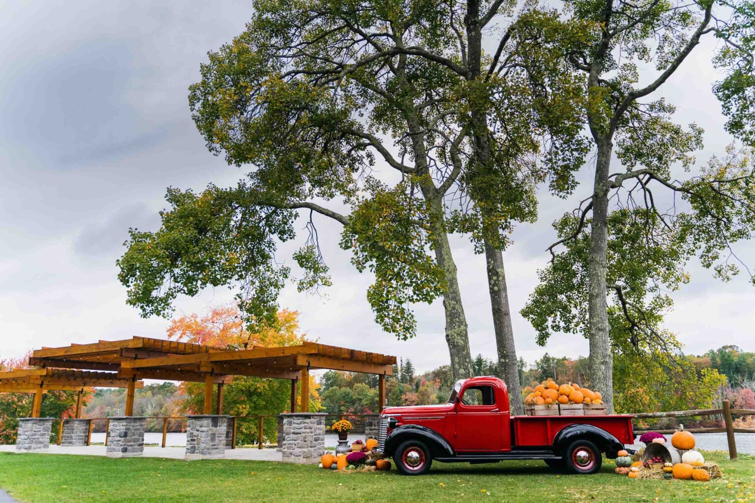 red truck next to a pergola.
