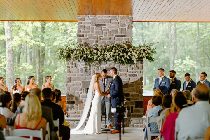 Wedding ceremony in front of the pavilion fireplace.