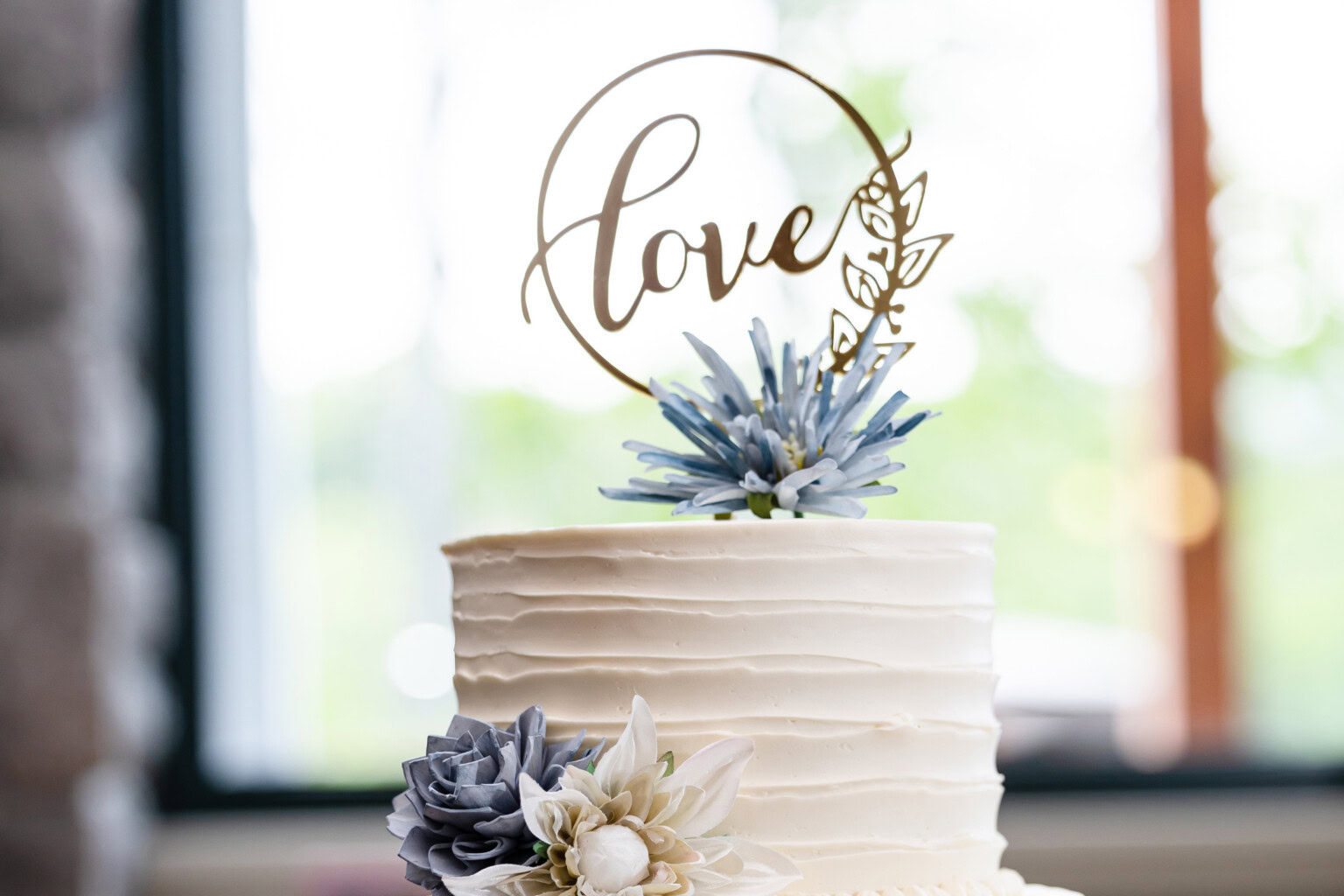 Love scrollwork cake topper with florals