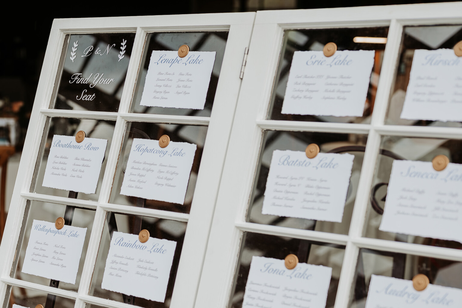 Seating chart on old window panes.