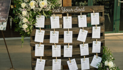 Table seating chart on wooden slat wall