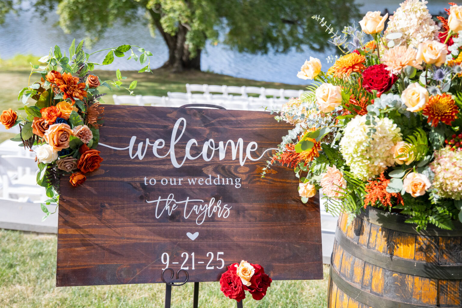 Flowers and sign at ceremony entrance.
