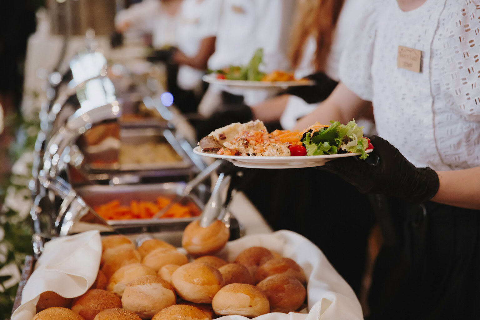 Food being served on the buffet line